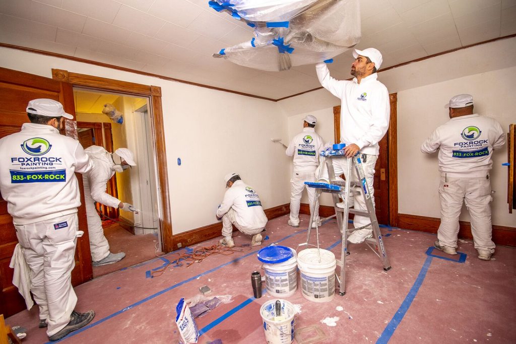 workers painting a room
